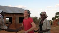 Lisa Merton dancing with GBM members near Machakos, Kenya