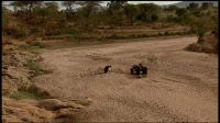 Digging for water in a dry river bed near Kavumbu, Kenya