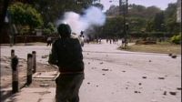 Police firing tear gas at students protesting the destruction of Karura Forest, 1999